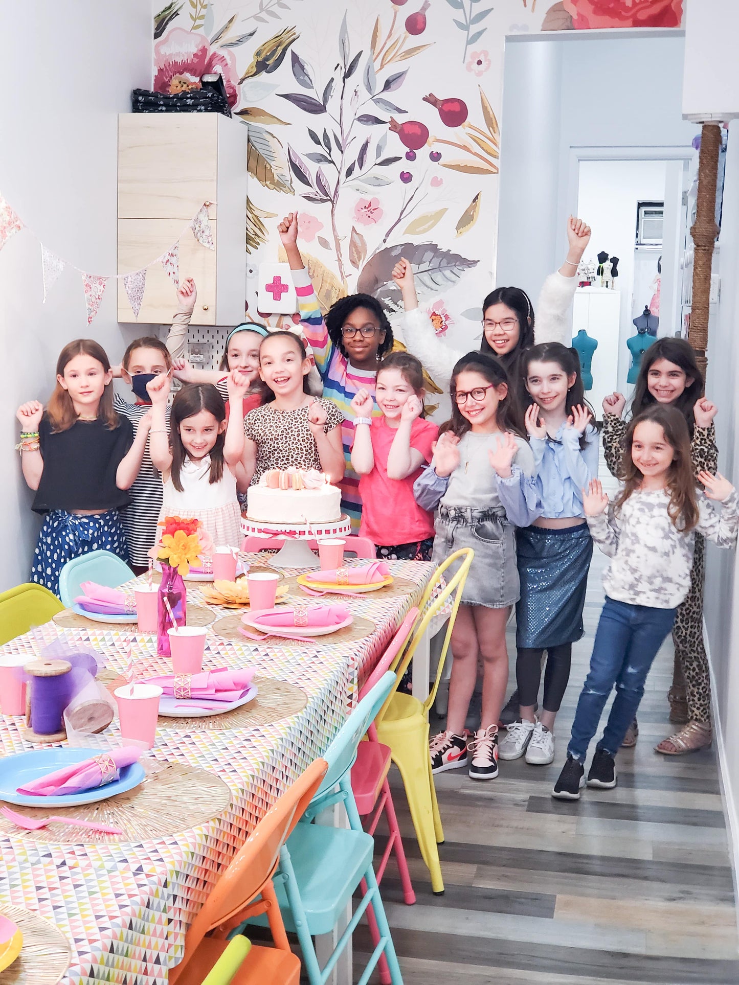 Girls posing together for a picture in a craft workshop