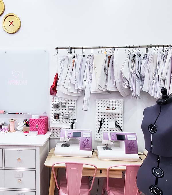 Sewing machines, model display, and clothes in workshop