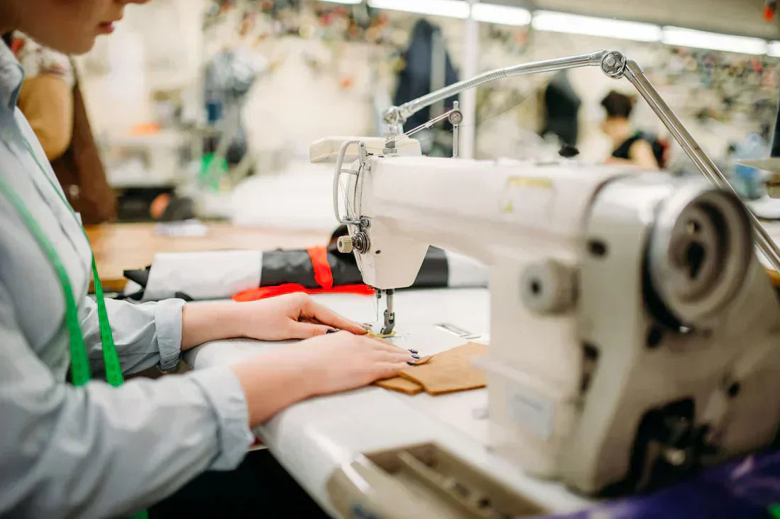 A teeager girl working on a sewing machine